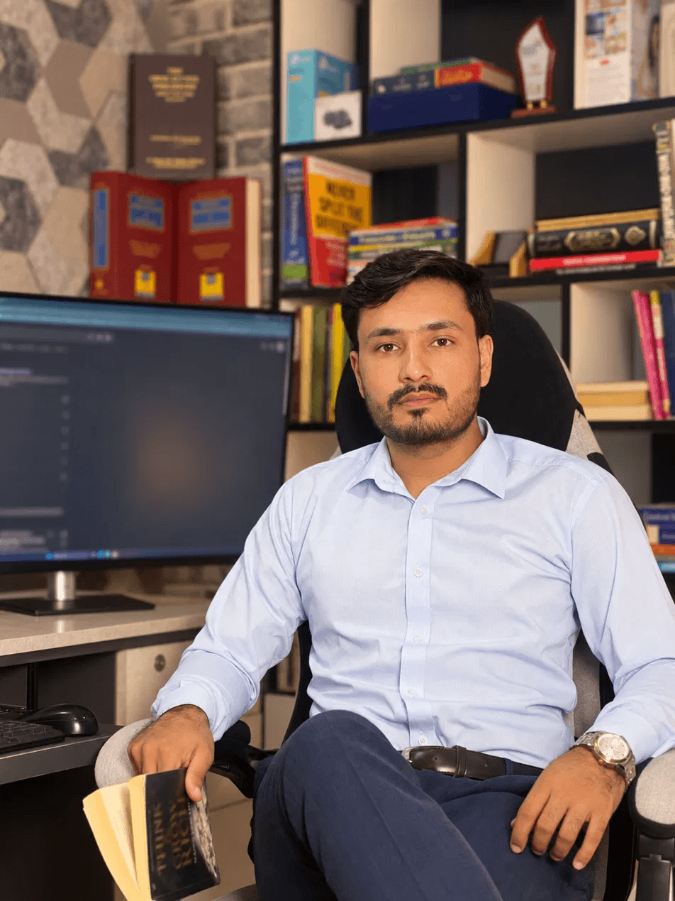 Kashif Hameed seated in his Hawks Global office, looking at the camera